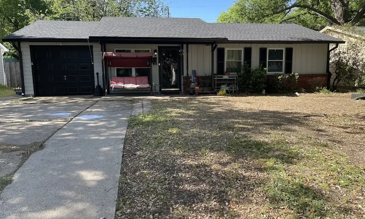 Asphalt Shingle Roof Repair crew at work on a residential roof in Swainsboro